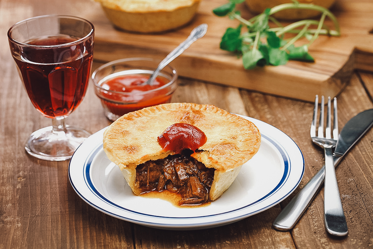 Aussie meat pie topped with tomato sauce