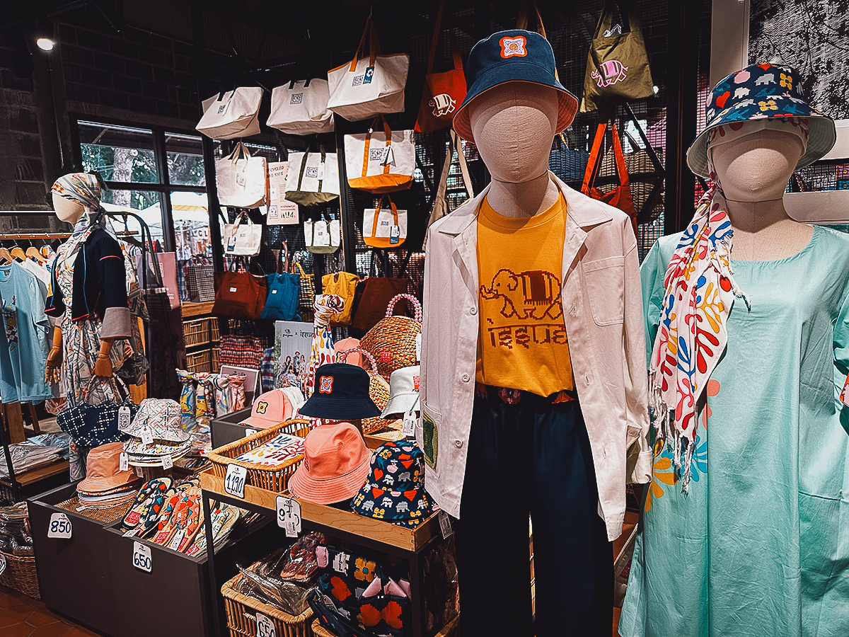 Clothing and hats for sale at Good Goods store in Chiang Mai