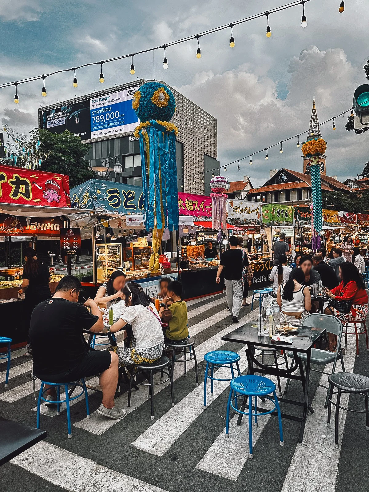 Tables and food stalls at Think Park night market in Chiang Mai