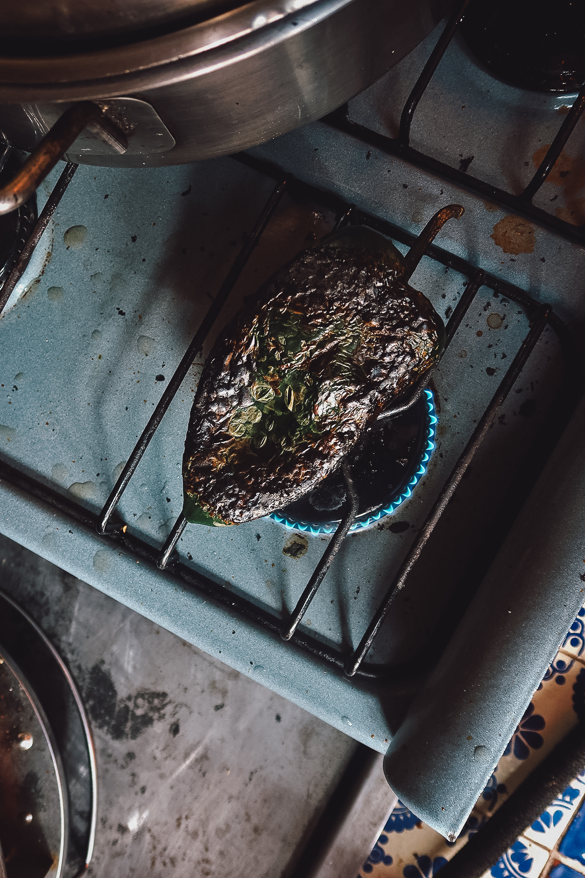 Blistering poblano peppers