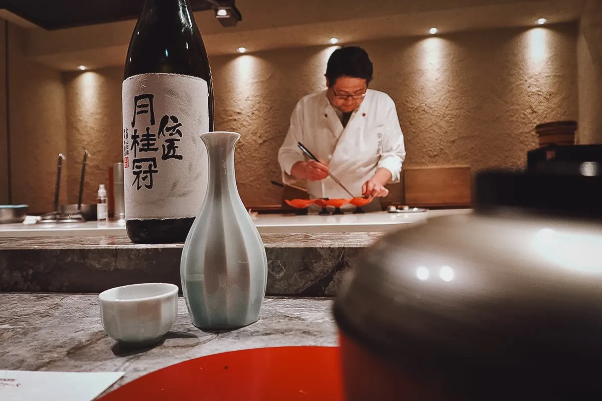 Chef Nomura preparing a dish