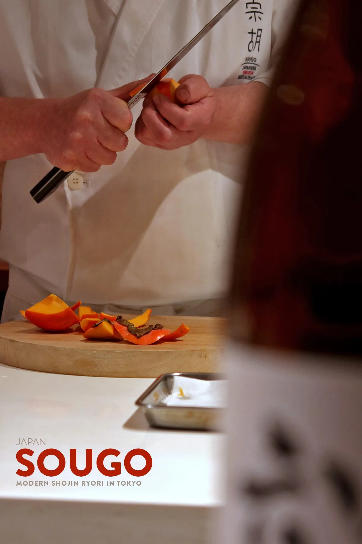 Chef Nomura slicing persimmon